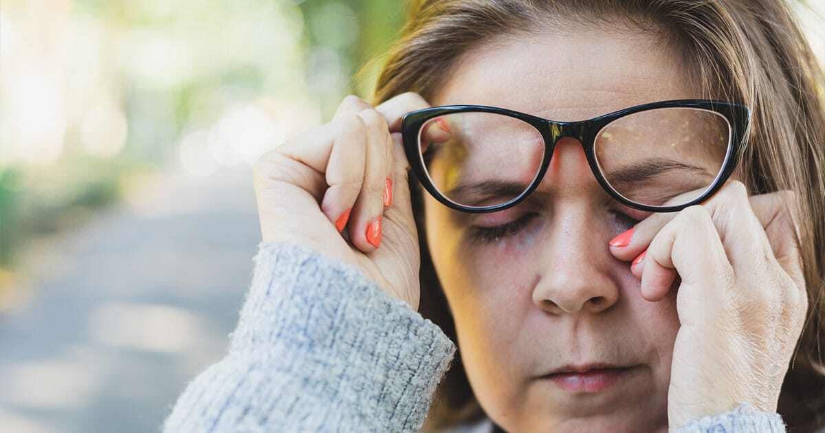 Woman rubbing her eyes