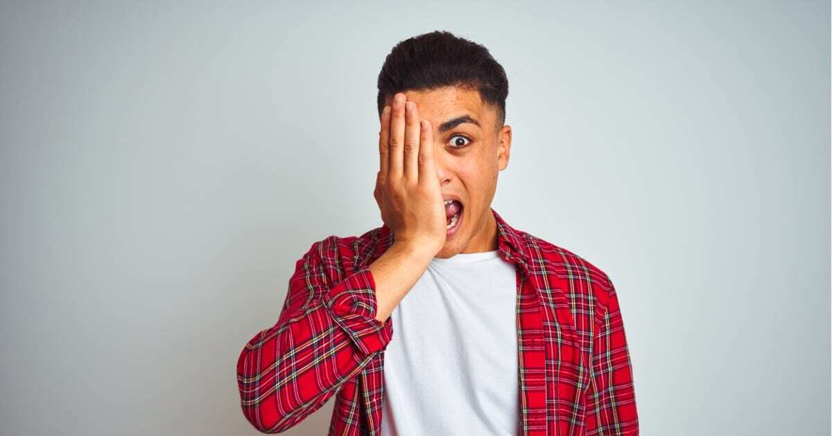 man covering one eye