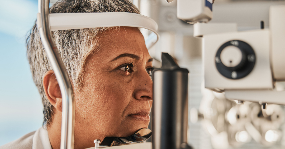 A woman having an eye exam to check for UV light damage.