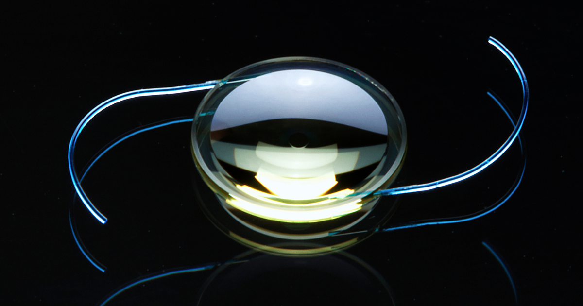 A light adjustable lens against a black background.