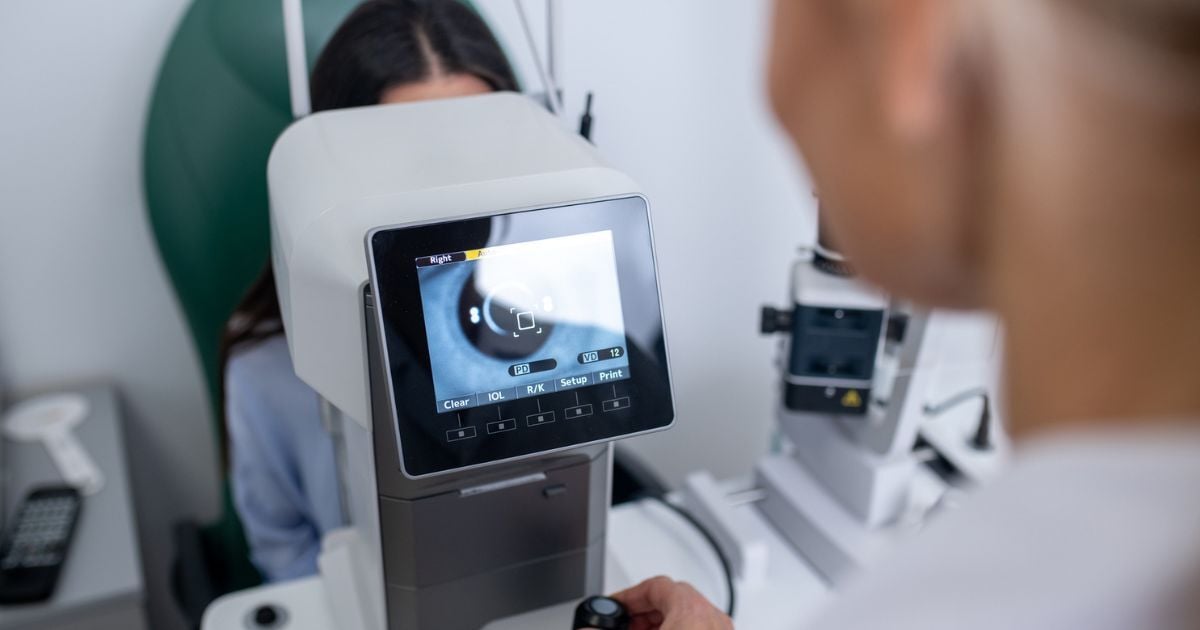 A woman having an eye exam to treat her chronic dry eye.