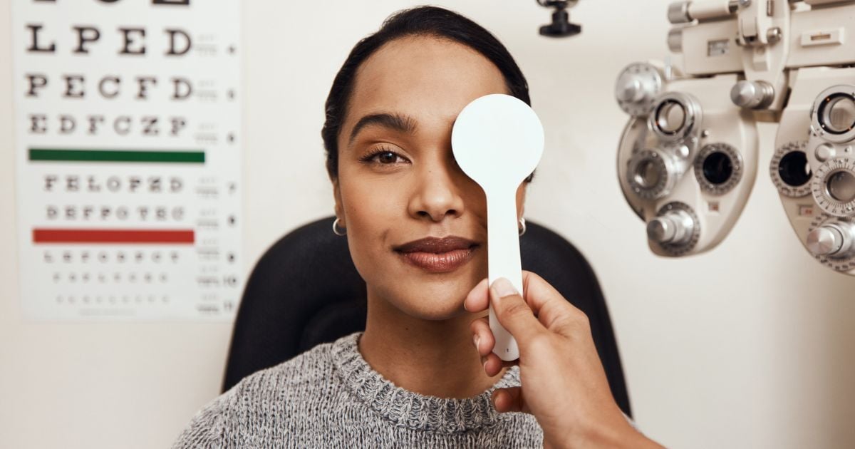 A woman having an eye exam for her dry eye symptoms.