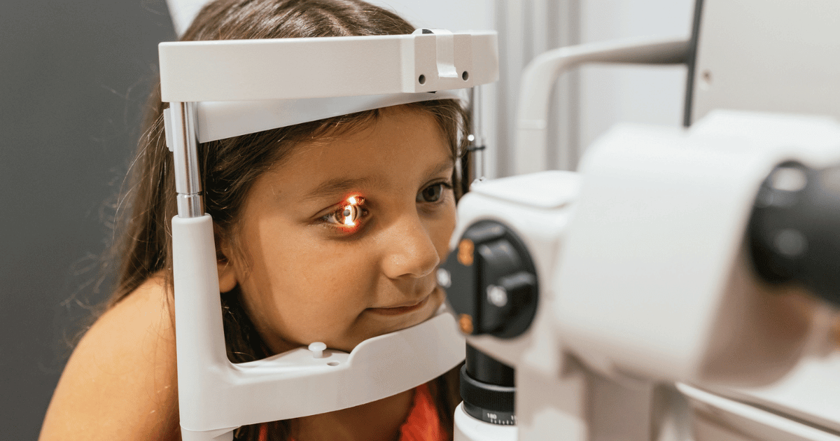 A young girl having an eye exam.
