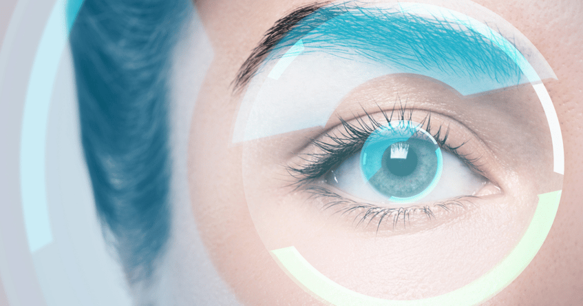 An upclose shot of a woman's eye that has blue circle around it.