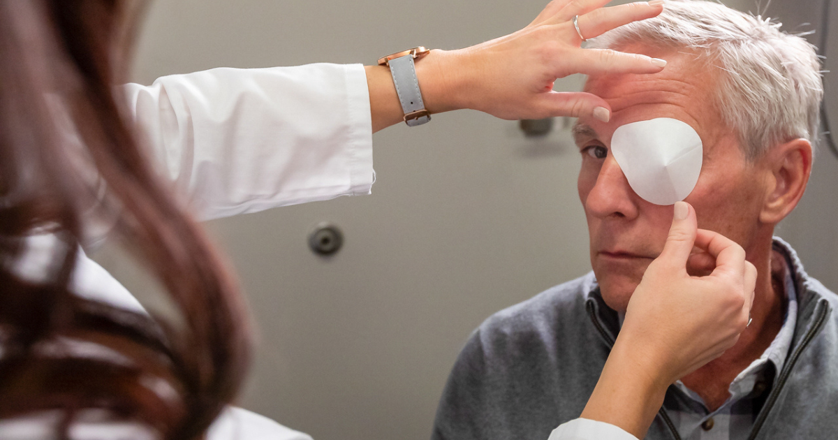 A man being fitted with a patch after his light adjustable lens surgery.