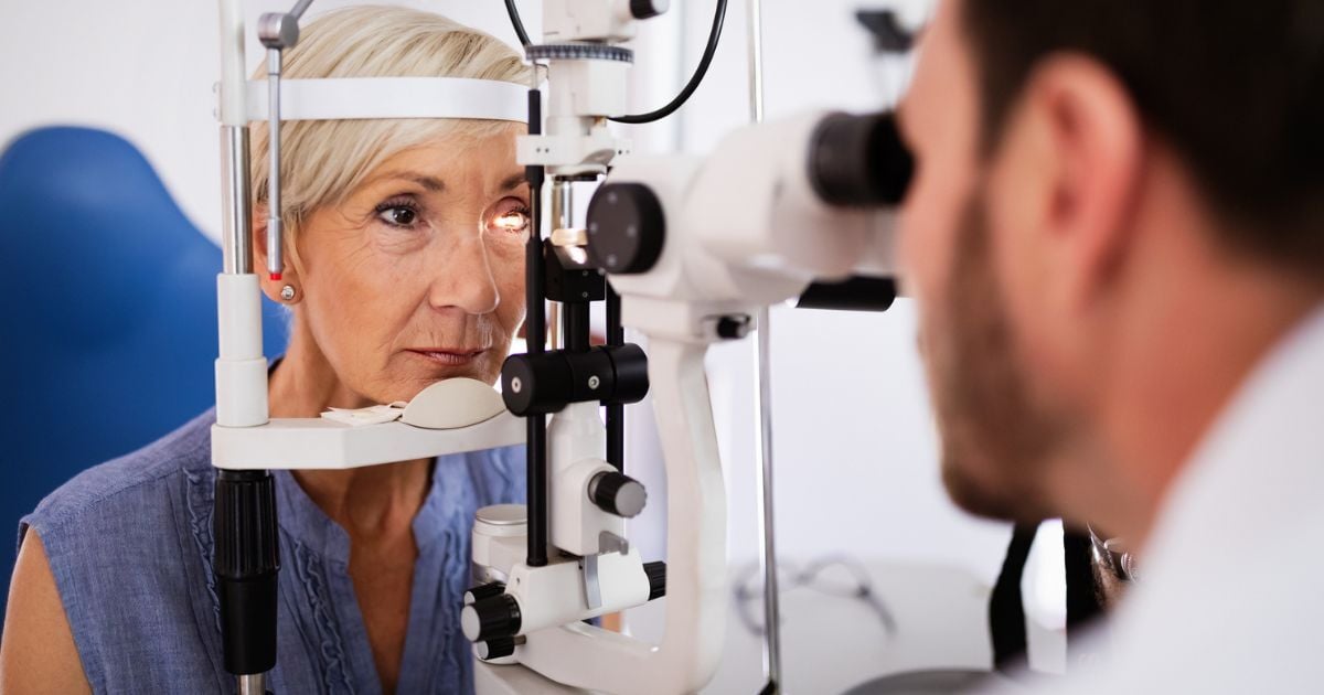 A woman having an eye exam to treat her dry eye that is disrupting her sleep.