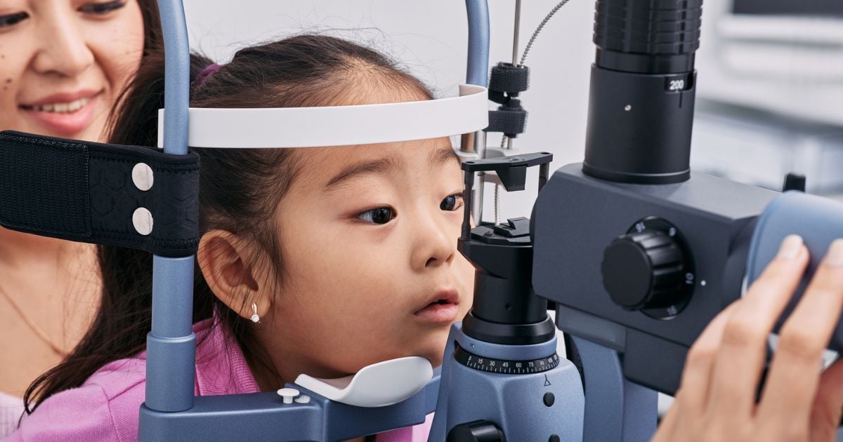 A little girl having an eye exam.